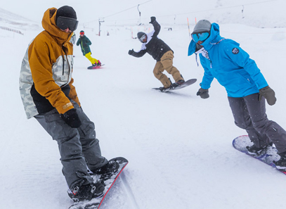 A group of people snowboarding